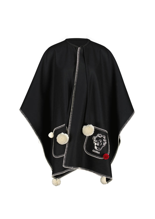 Woollen poncho with pompons