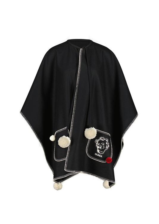 Woollen poncho with pompons